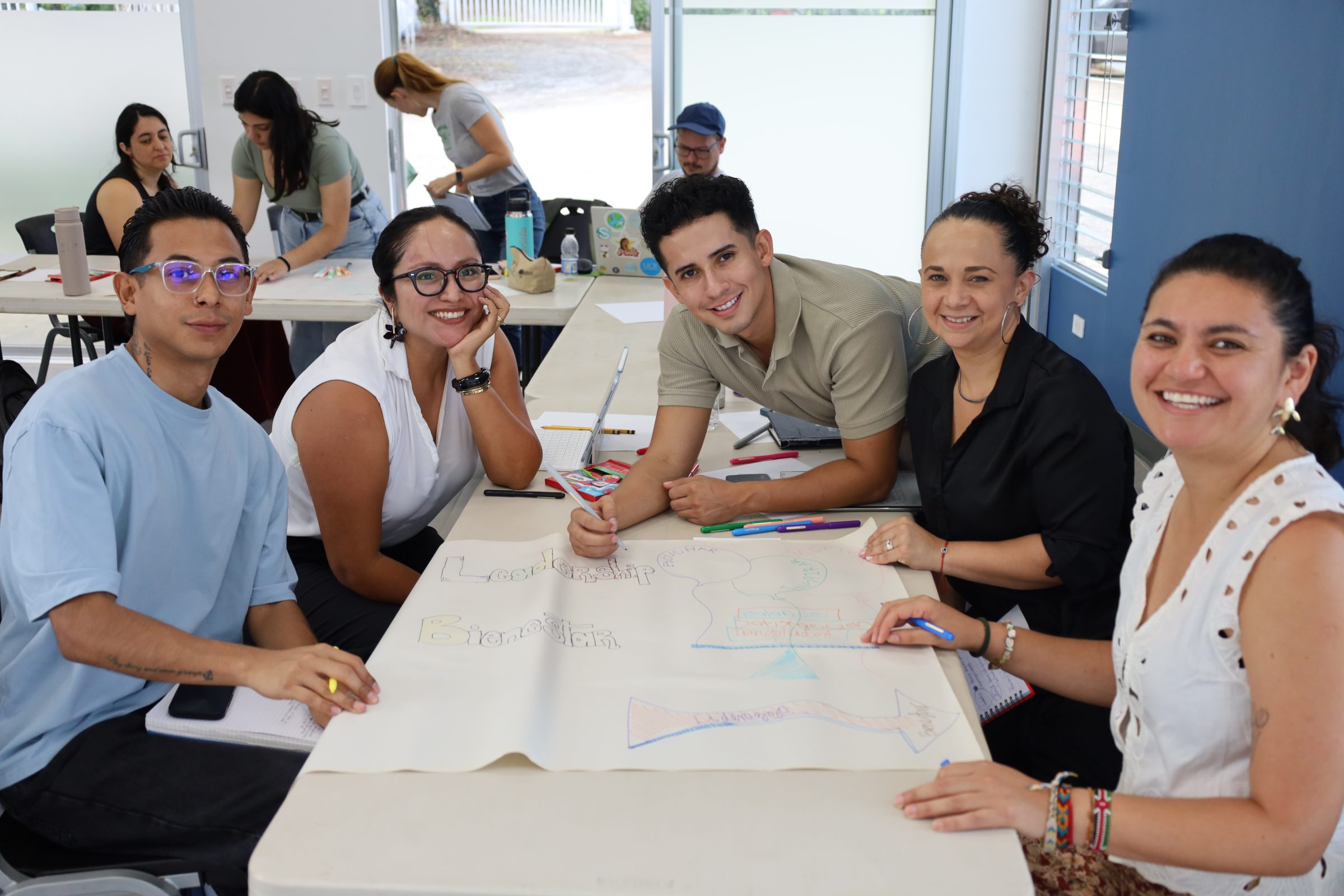 Participants collaborating during a UPEACE workshop